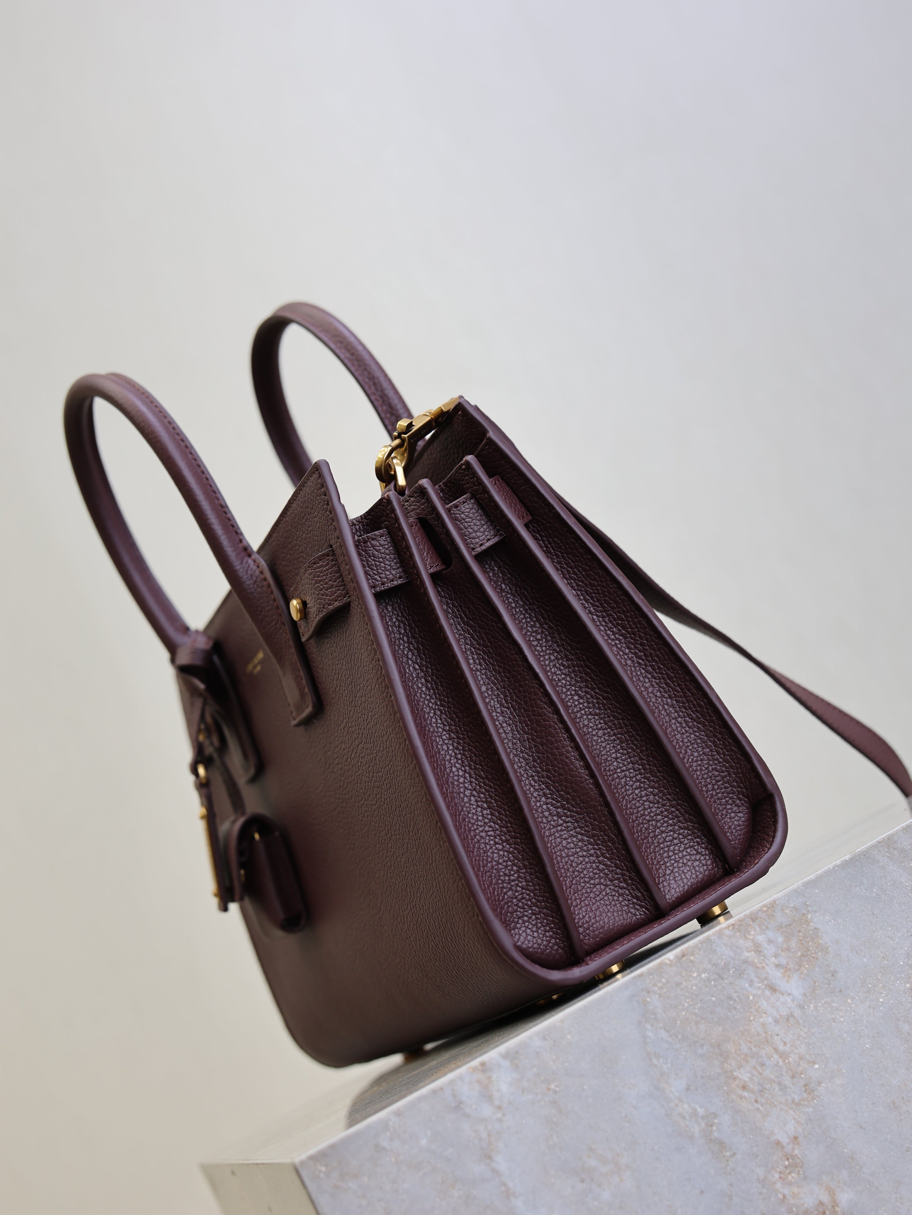 YSL 25S SAC DE JOUR MM 26 IN ROUGE CABERNET SUPPLE GRAINED CALFSKIN